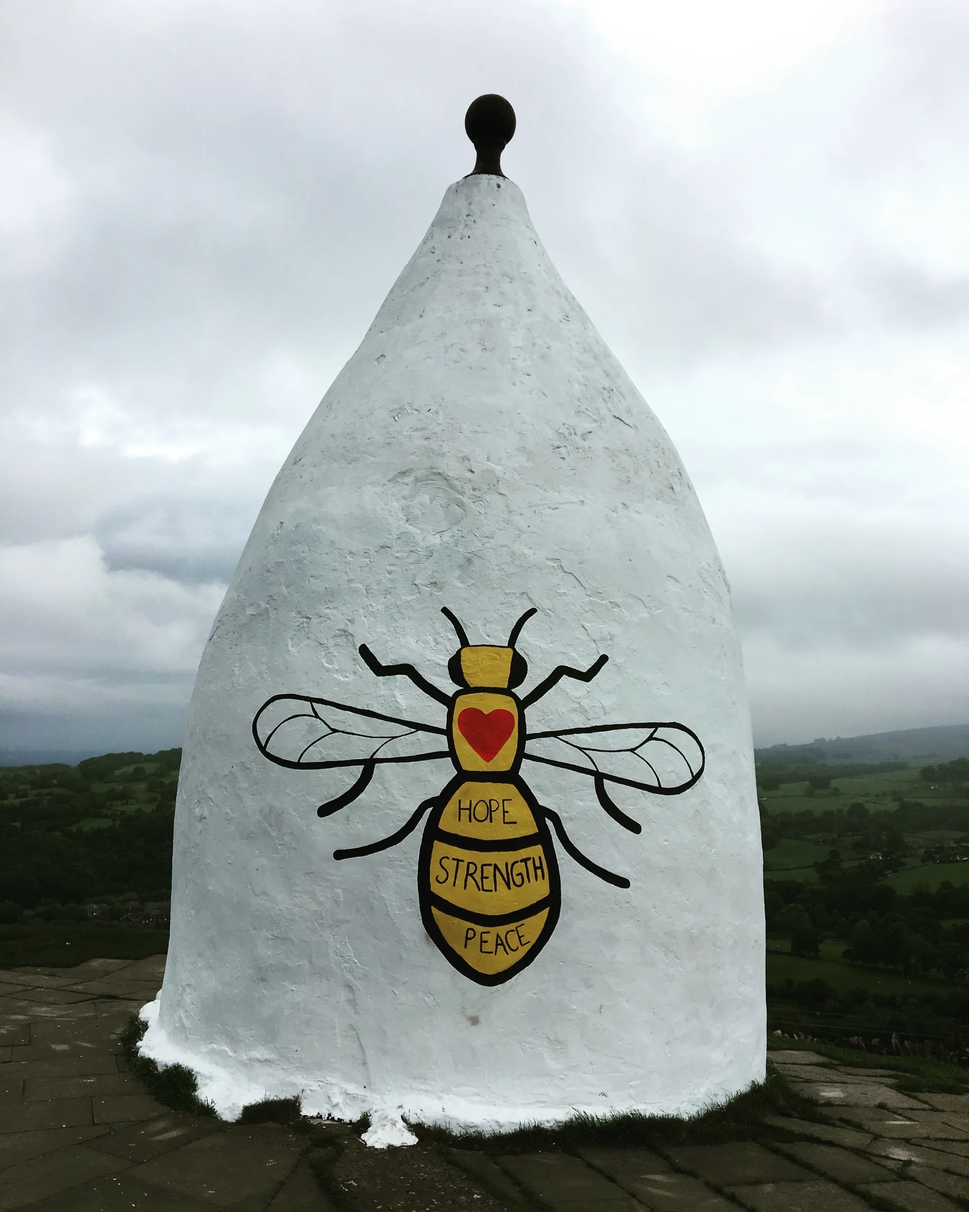 Illustration of a bee with Hope Strength Peace